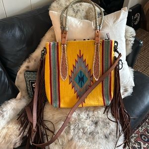 American Darling large messenger bag with top handles, fringe and shoulder strap